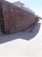 اجرای عملیات دیوار حائل سنگی وهدایت آبهای سطحی شهرک ارشاد در سنندج