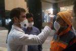 توزیع ماسک و تب سنجی سربازان خط مقدم خدمات رسانی به شهروندان