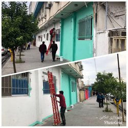 عملیات رنگ آمیزی بخش از دیوار اصلی بیمارستان شهید رجایی بهمت واحد زیباسازی شهرداری